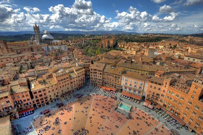 Discover the Medieval Charm of Siena on a Private Walking Tour - Palazzo Tolomei: the symbol of Siena and its medieval legend