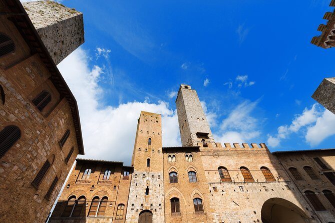 Small-Group San Gimignano and Volterra Day Trip from Siena - San Gimignano on foot: towers, Via Francigena, and saffron-town charm